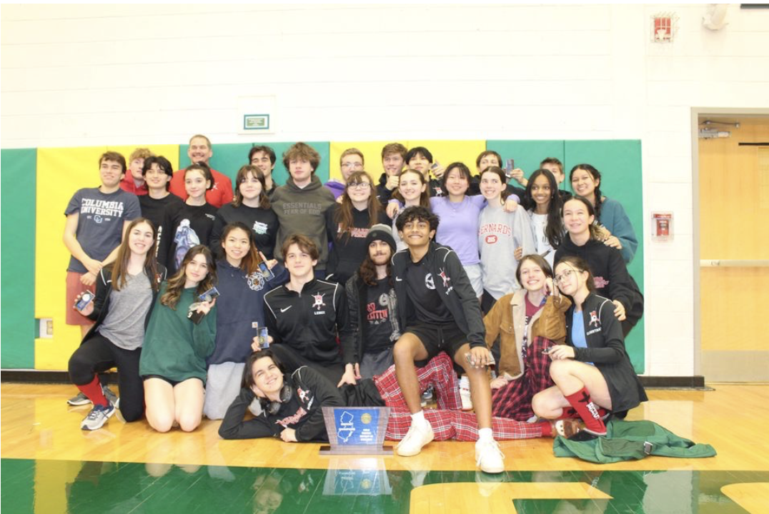 The Bernards High School fencing team celebrates their district accomplishments 